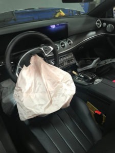 deployed airbag in a car