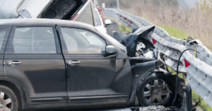 car crashed on sidelines of highway